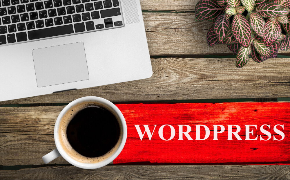 Почему клиенты чаще всего заказывают сайты на wordpress? 1 top-view-of-coffee-cup-and-keyboard-with-wordpress-inscription-on-table